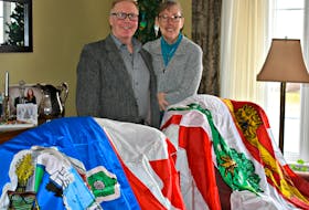Alan and Glenda Mulholland have received a wave of support, including three official flags to fly on Wave Rover.