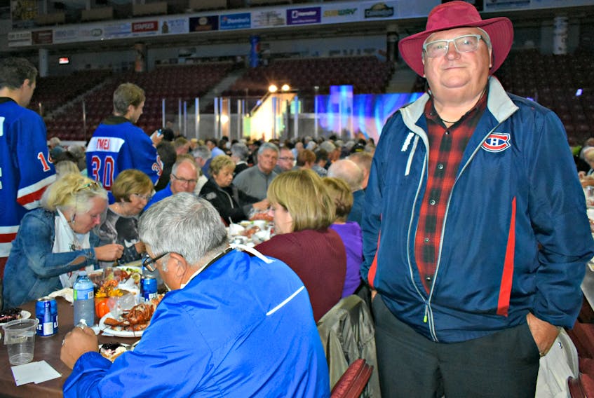 Lynden Ellis didn't let a downpour and blustery winds dampen his spirits for the Grass Roots and Cowboy Boots fundraiser held Saturday evening at the Credit Union Place in Summerside