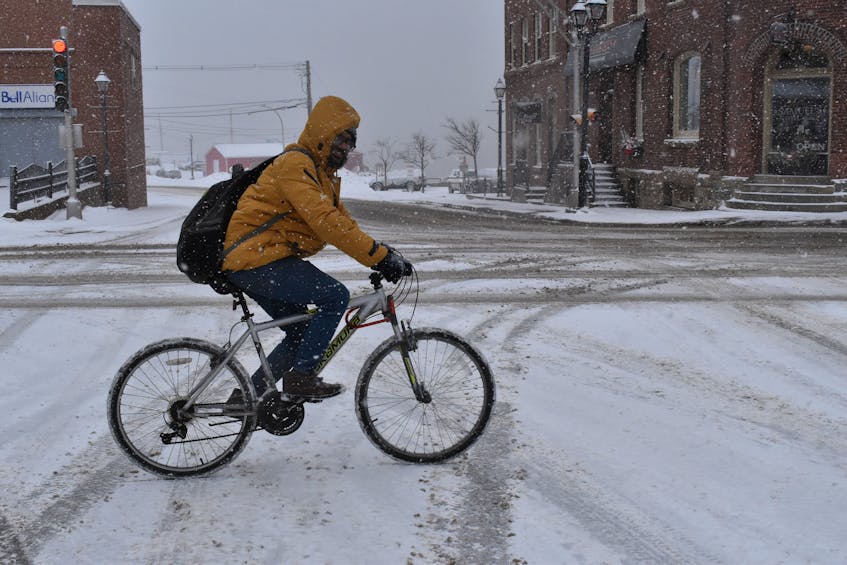 Salman Munshi bikes home through snowy streets from classes in the Precision Machinist program at Holland College