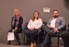Pam Schurman Montgomery, executive director of the Central Development Agency, left, Vanessa Jollimore and Cody Clinton from the Department of Social Development and Housing answer questions in Kinkora March 4 as residents gathered to discuss housing options in electoral district 19.
