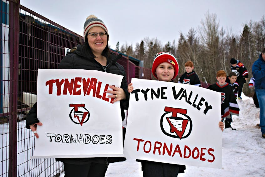 Kim Hutchinson, left, and her son Ryan came to show their support for Tyne Valley. More than 1,000 people gathered in front of the former Tyne Valley Community Sports Centre in a Kraft Hockeyville bid, Saturday morning.