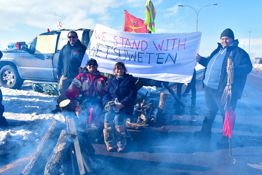 Janet Banks, front left, Jackie Gallant, Gilbert Sark, back left, and Chance Banks peacefully support the Wet'suwet'en Nations protests in B.C.