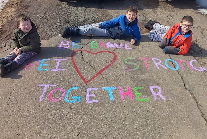 Wyatt, Logan and Ethan Bernard spent part of their weekend drawing inspirational messaging on their driveways for their whole neighbourhood to see. Several families on Wilfred Street in Miscouche did the same.
