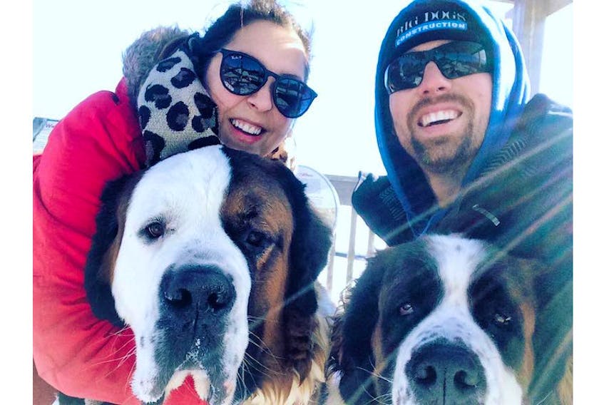 Kolby Perry, left, and her husband, Adam, with their dogs Jasper, left, and Georgia.