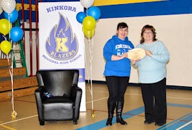 Shelley Tremere, left, being presented the Extra Mile award by P.E.I. Home and School Federation treasurer Donna MacLeod.