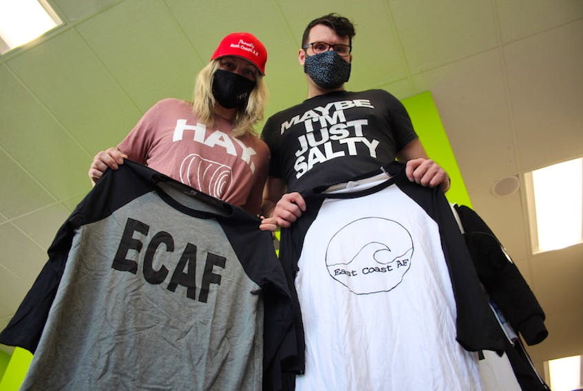 Megan McDonald and Luke Walker show off some of the apparel from their clothing brand ECAF.