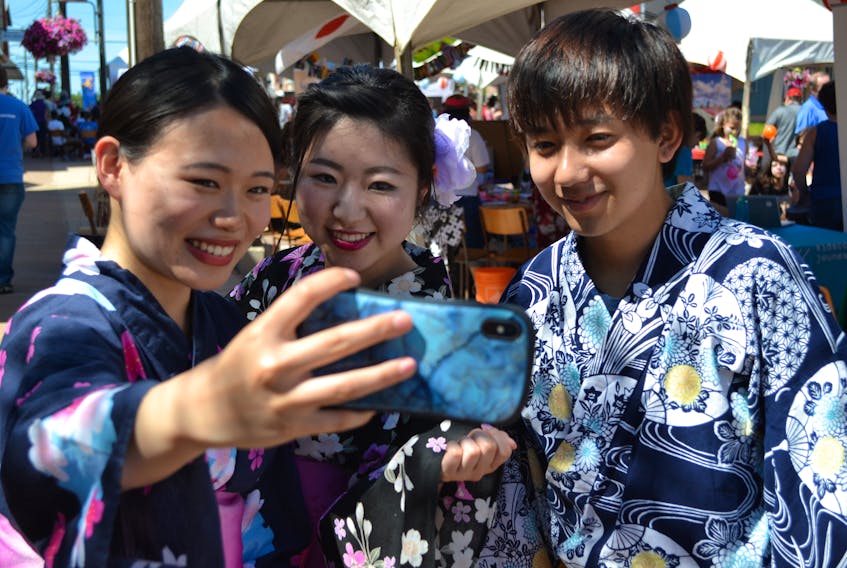Charlottetown residents, from left, Ruwi Hoshino, Ayami Iida and Tenma Miyasaka pause for a selfie while dressed in traditional Japanese yukata during last year’s DiverseCity Multicultural Festival in Alberton. Alberton serves as the festival’s Prince County host for a second consecutive year this Sunday. Journal Pioneer file photo