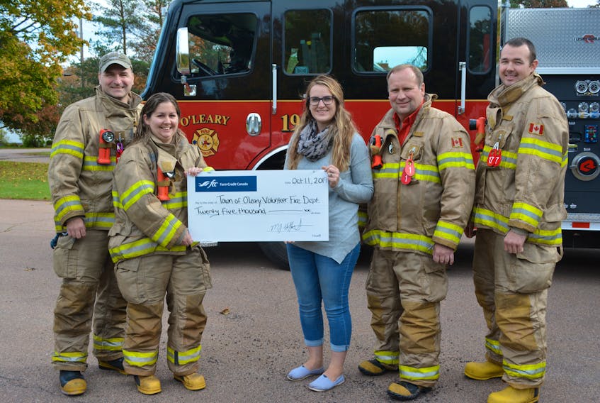 Laura Dickson, center, Farm Credit Canada’s relationship manager for P.E.I. presents a $25,000 donation from the crown corporation’s Agri-Spirit Fund to the O’Leary Volunteer Fire Department. Accepting the cheque, which will be used to purchase replacement bunker gear, are, from left, Blain Buchanan, Valene Gallant, Chief Ron Phillips and Matt Hardy. The department anticipates the money will outfit up to 12 of the department’s 28 firefighters with new gear.