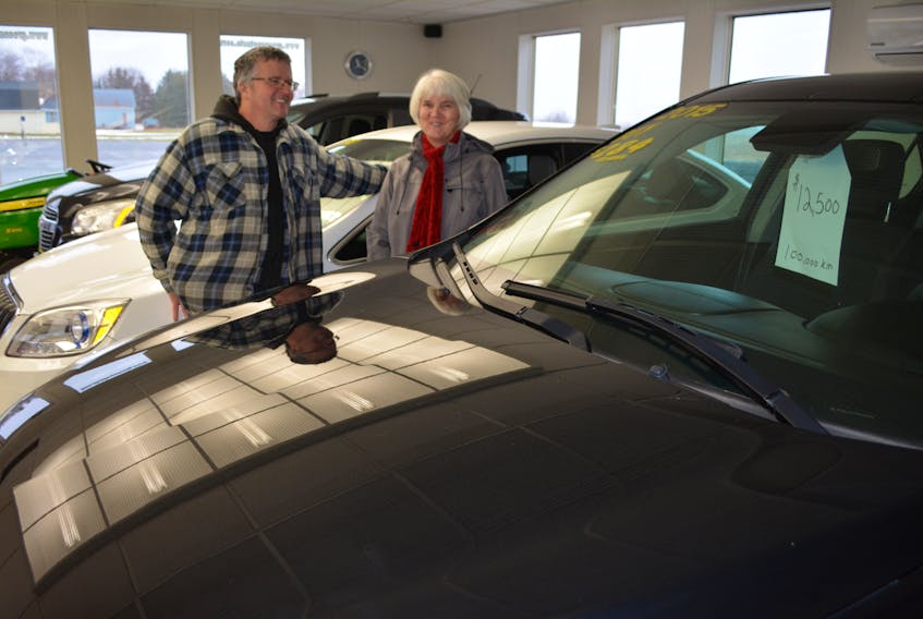 Salesman Allan Gorrill and his sister Joyce MacDougall in the Greenspot Auto Sales Showroom. They are in the process of selling off the remaining inventory of a business MacDougall’s late husband, Norman, started 47 years ago. The car lot is also for sale.
Eric McCarthy/Journal Pioneer