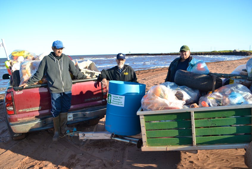 Roseville/Miminegash Watersheds Association Inc. workers, from left, Milton Chaisson, Thane Doucette and Danny Murphy display the debris their September beach sweep netted.