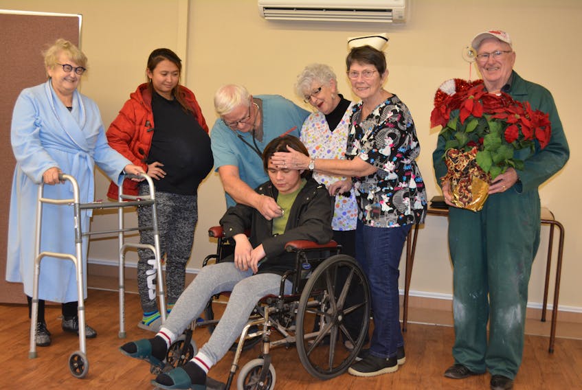 Marie (Airam Domingo), second left, looks on as her husband, Joseph (Karl Bajamube), gets all the medical attention in "Special Delivery", the O’Leary Town Players’ Christmas dinner theatre production. From left are, Adrienne MacDonald, Domingo, Dale Howard, Sandra O’Meara, Bonnie MacNeill and Blair Bernard. There's one more showing, set for tonight.