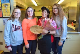 Hernewood Intermediate school students congratulate Lorna "the Lunch Lady" MacIsaac on receiving the P.E.I. Home and School Federation’s 2020 Extra Mile Award. MacIsaac has been preparing meals, handling cash and doing cleanup in the Hernewood cafeteria for 26 years. From left Maggie Stewart, Kalyn MacWilliams, MacIsaac and Kira Costain - Eric McCarthy