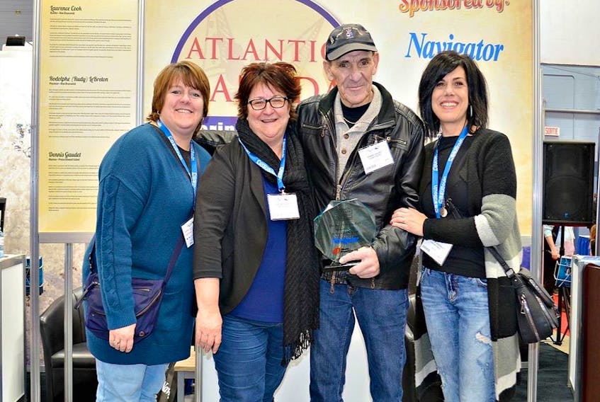 Dennis Gaudet is congratulated by members of the Tignish Fisher Awards committee, the group that nominated him for induction into the Atlantic Canada Marine Industries Hall of Fame. From left are Tina Richard, Ruby Arsenault, Gaudet and Paulette Arsenault