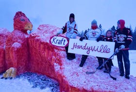 Members of the Hardy family, from left, Bradley Hardy, Janet Hardy Callaghan, Emma Hardy and Landon Bulger pose with their Kraft Hardyville sculpture they helped create for the Tyne Valley Winter Carnivals snow sculpture competition. The design stems from the idea of a phoenix rising from the ashes.