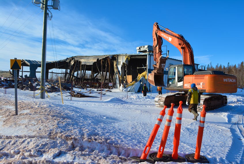Demolition equipment moved onto the site Wednesday to start dismantling what's left of the Tyne Valley rink following the Dec. 29 fire. A project committee is hoping to have construction started on a new arena this year.
