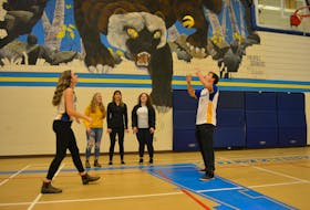 Jackie Lynn Arsenault and Lucas Gallant, middles on the Westisle Composite High School senior AAA volleyball teams, put on a volleying clinic for members of the school’s leadership class, which is coordinating this weekend’s Wolverine Volleyball Classic. Looking on, from left, are Madison McHugh, Emily Matthews and Sophie Fraser.