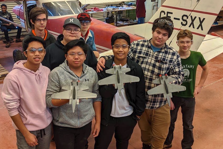 Three Oaks Senior High aerospace and aviation students got together to make fighter jet models for kids at Christmastime. Back, from left, are Malcolm Merx, Nathaniel Mueller and Jack Mills. Front from left, Eddward Magtagnob, McLester Reyes, Eryl Regalado, Austin Arsenault and Gabriel Bujenita.