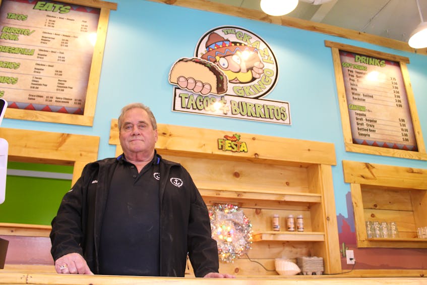Mike Perry (Sr.), president of the Perry Group, behind the counter at The Crazy Gringo, the latest in a string of restaurants the organization has opened in Summerside.