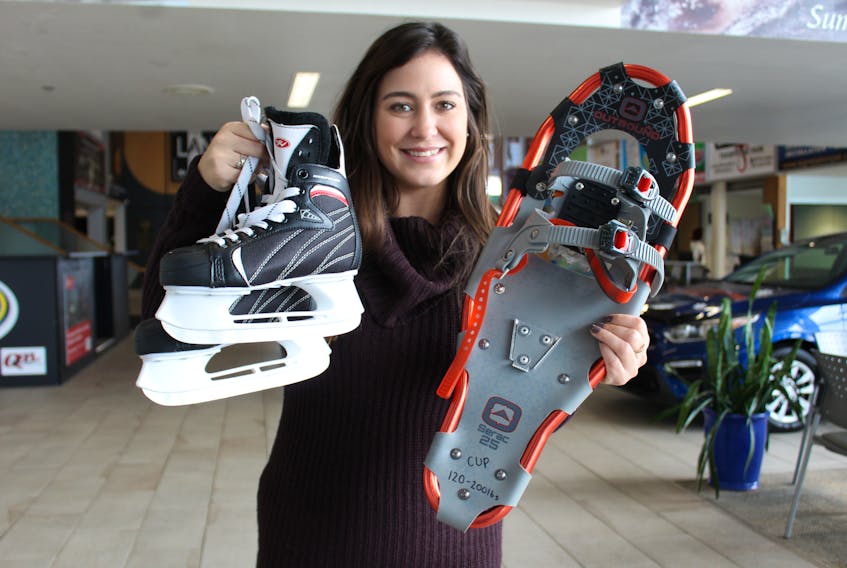 Colin MacLean/Journal Pioneer
Toni Geary, Summerside’s community activities coordinator, shows off some of the winter sporting equipment available for rental at the Credit Union offices in Summerside as part of the city’s Active Winter program.