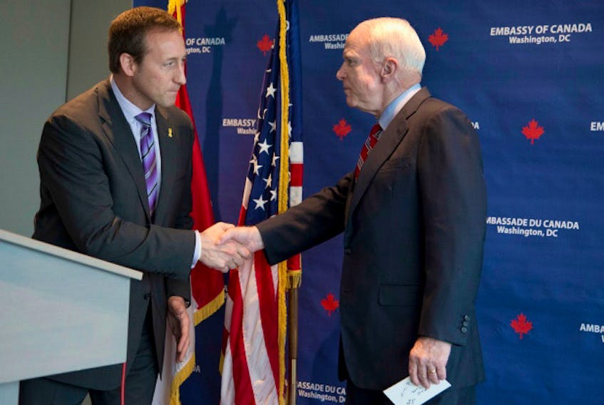 Peter MacKay is shown in this 2012 photo presenting U.S. Senator John McCain with an honourary degree from Canada's Royal Military College.