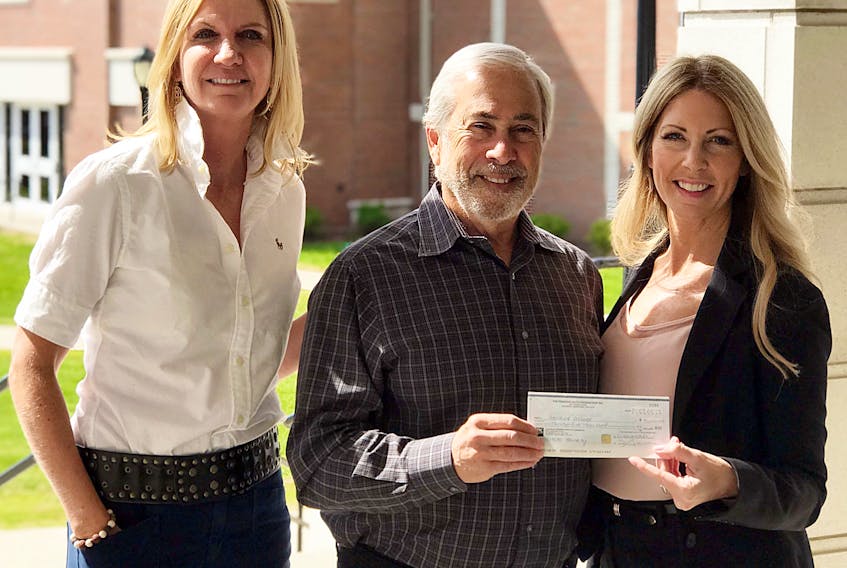 Natalie Mitton, left, vice-president, academic and applied research at Holland College, and Jo-Ann Campbell-Boutilier, executive director of the Holland College Foundation, accept a $35,000 cheque for the 2019/20 Princess Auto Foundation Entrance Awards from David Shnider, director for the Princess Auto Foundation.