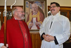 The Right Reverend Ronald Cutler, left, Bishop of the Diocese of Nova Scotia and P.E.I., chats with Rev. Colin Nicolle before his ordination in the Anglican priesthood earlier this week at St. Mary’s Anglican Church in Summerside.