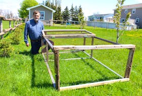 Jiri Rambousek is seen with the beginnings of his new chicken coop. He’s applied to the city for a permit to house up to four hens. If approved, he would be the first person in more than a decade to obtain such a permit. Colin MacLean/Journal Pioneer