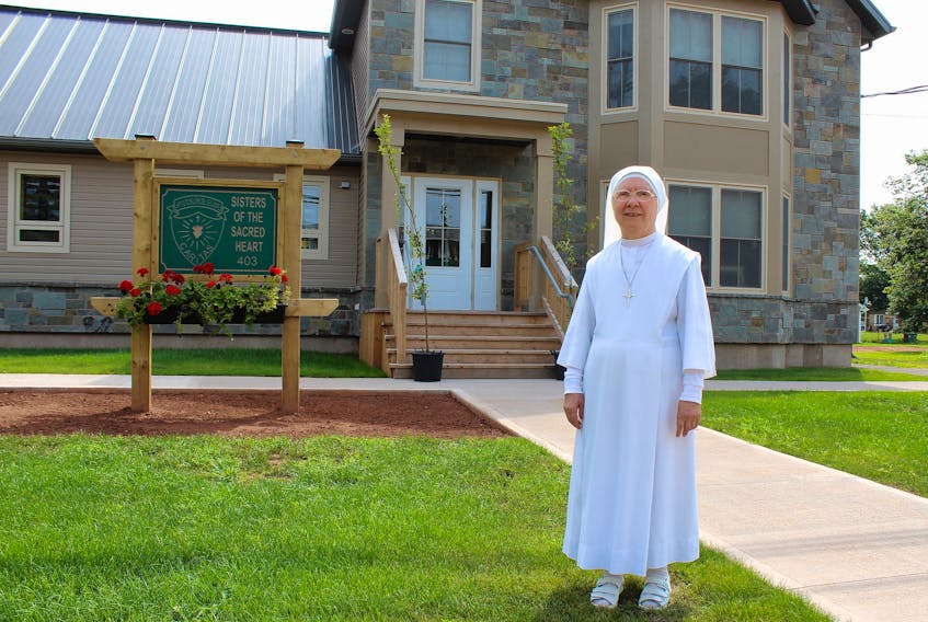 Sister Margherita Ianni of The Sisters of the Sacred Heart of Jesus of Ragusa, outside her order’s new convent on Granville Street in Summerside. The sisters recently moved into their new home and are holding an open house to celebrate.