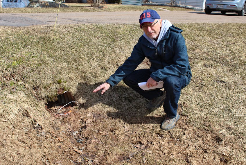 Ron Hatton wishes his culvert, now partially filled with debris, was replaced storm water system.