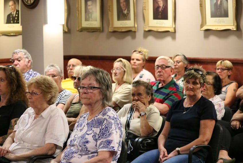 Residents from Heritage Trailer Park listen as Summerside city councillors put forward a resolution requesting the provincial government update or create legislation that would better protect residents of mobile home parks on P.E.I.