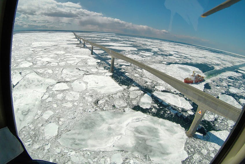 A Canadian Coast Guard icebreaker cuts a path through the Northumberland Strait and under the Confederation Bridge in this aerial shot. Ice conditions around P.E.I. are improving by the day, but there is still considerable ice in northern New Brunswick, which is delaying the start of the snow crab fishery.