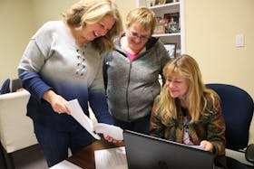 Susan Rodgers, left, Edith Cole, and Joady Walton look over the script of Rodgers’s movie, “Still the Water.”