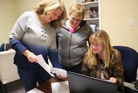 Susan Rodgers, left, Edith Cole, and Joady Walton look over the script of Rodgers’s movie, “Still the Water.”