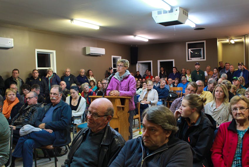 Krista Hagen, centre, took to the microphone at Sunday’s meeting where more than 200 people attended to voice their concerns about Borden-Carleton’s possible application to annex the town’s surrounding fire district and the Albany area the Borden-Carleton Fire Department does not service. Millicent McKay/Journal Pioneer
