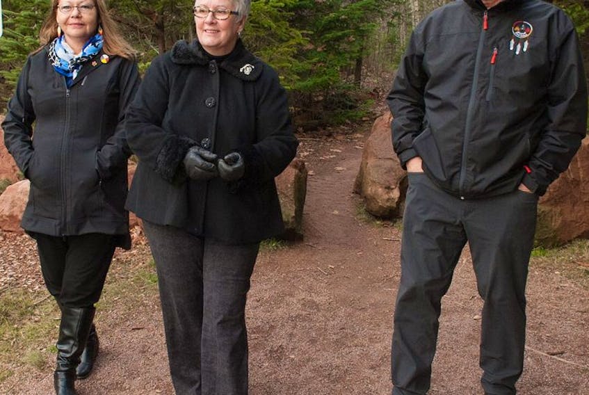 Minister Paula Biggar, Transportation, Infrastructure and Energy, joins Chief Brian Francis, Abegweit First Nation, and Chief Matilda Ramjattan, Lennox Island First Nation, in viewing the newly named  Ji'ka'we'katik Trail in Bonshaw Hills Provincial Park. The trail is named for the traditional Mi'kmaq name of the West River which runs through the 639-acre park.