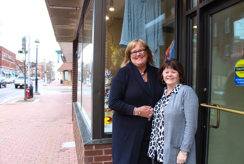 Norma Profit-McNeill, left, owner of The Tickle Trunk and Edge 251, and Carol Peters, owner of Sheen’s for Shoes, are taking over organizing the Downtown Summerside Sidewalk Sale this year.