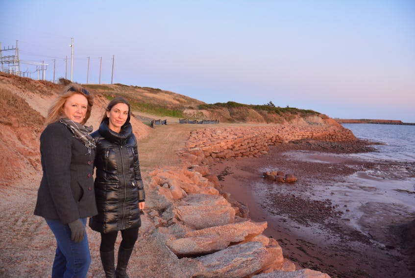 Barb Wood, left, and Laurel Palmer Thompson, stand at a Borden-Carleton beach below the Maritime Electric station in that community. Residents like them had expressed concerns about the status of the beach during construction of the province’s new power cables, but now say their major concerns have been assuaged with the recent remediation of the site.