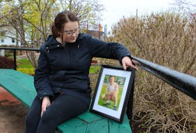 Alexis Skiffington holds a photo of her uncle, Jeremy Stephens. Skiffington and about a dozen family, friends and supporters gathered in a Summerside park Monday afternoon to commemorate the one-year anniversary of Stephens’s death. He was shot by Summerside police as they tried to arrest him.
