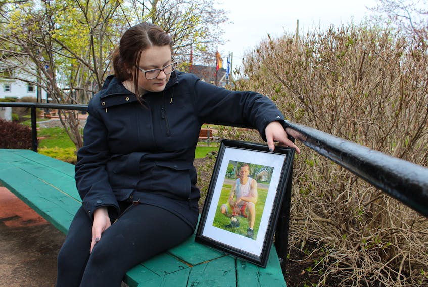 Alexis Skiffington holds a photo of her uncle, Jeremy Stephens. Skiffington and about a dozen family, friends and supporters gathered in a Summerside park Monday afternoon to commemorate the one-year anniversary of Stephens’s death. He was shot by Summerside police as they tried to arrest him.