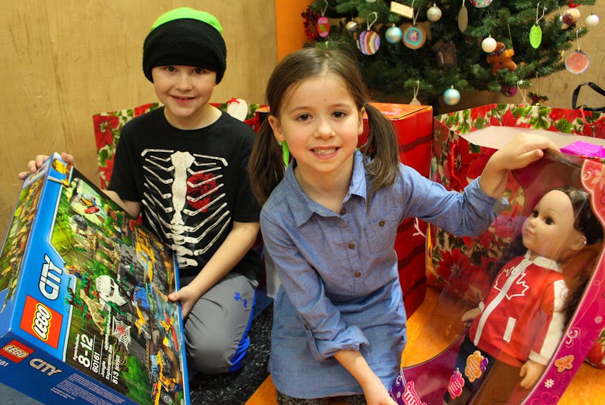 Cayden Gallant, left, and Stella Woodacre with their loot after being named the recipients of the Spirit of the Year Awards at the Boys and Girls Club of Summerside.