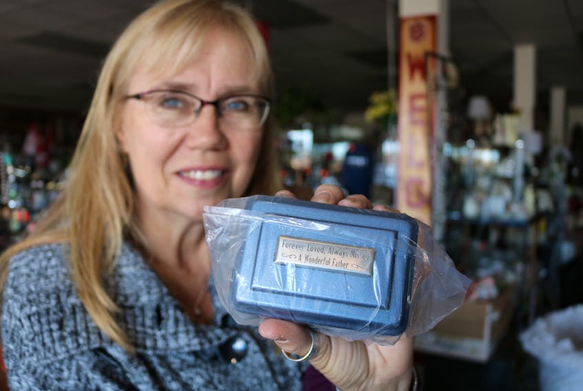 Anna MacDonald, manager of the Salvation Army Thrift store, says it was a fist bump moment when she was able to locate the owner of a memento urn that was accidentally donated to the store.