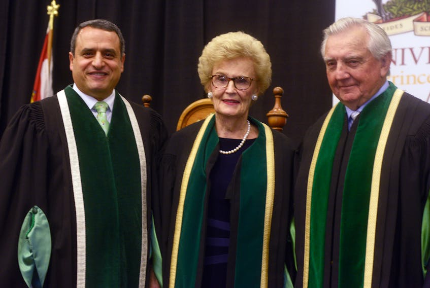 Catherine Callbeck, ninth chancellor of UPEI, centre, received her robes on Saturday. Those involved in the celebration were UPEI President and Vice-Chancellor Alaa Abd-El-Aziz, left, and outgoing chancellor Dr. Don McDougall.