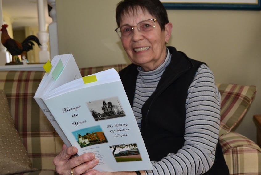 Krystyna Pottier refers to the history book on Western Hospital for a list of medical doctors who have served the hospital. She is currently part of a committee looking for ways to attract more doctors to West Prince.