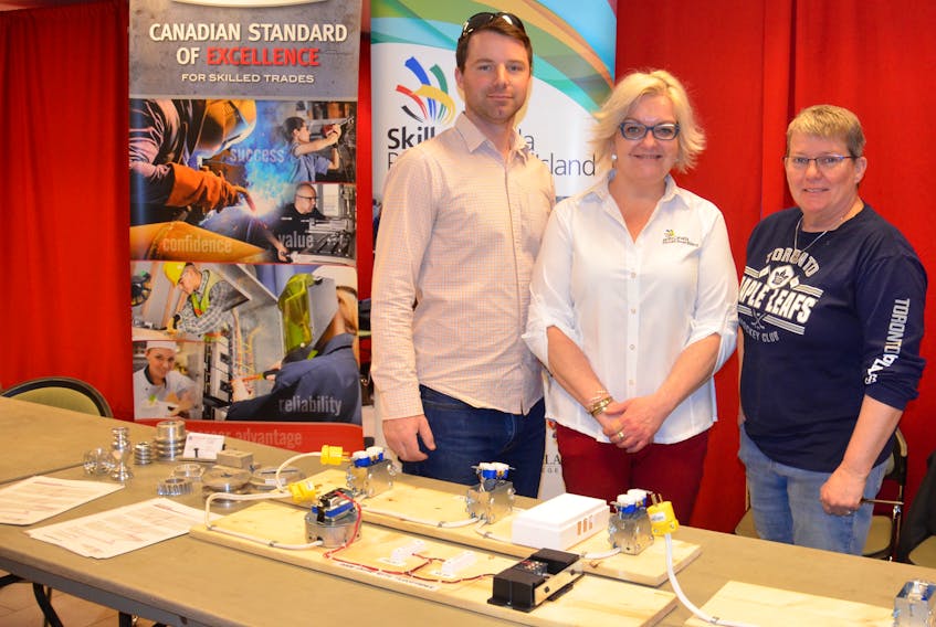 Jonathan MacDonald, apprenticeship training officer with Workforce and Advanced Learning, is joined with Tawna MacLeod, executive director of Skills Canada P.E.I., and Rosemary Crane, youth outreach co-ordinator with Skills Canada P.E.I., at the Credit Union Place in Summerside April 11 for a job fair hosted by Skills P.E.I.
