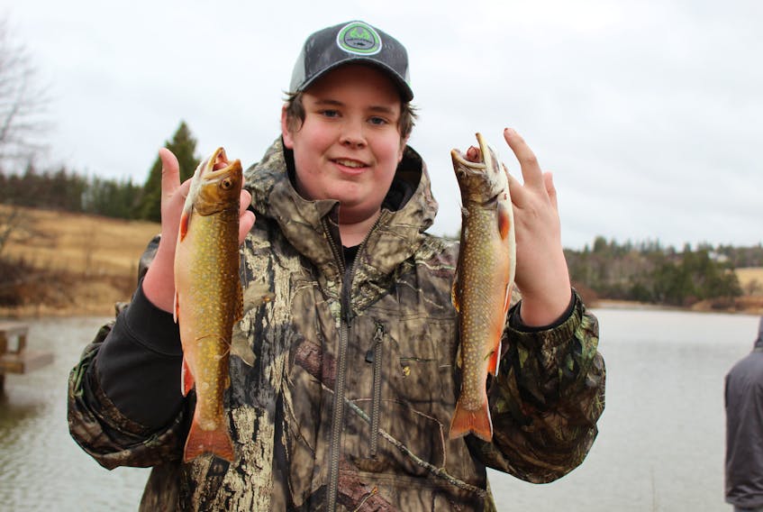 Tyler MacInnis from Oyster Bed shows off his catch on opening day.   He and pal Riley Hume were on the hunt for a good spot since 5 a.m. on April 15. They stopped at a few places before they tried the pond outside Crapaud.
“I caught one on the first cast,” said MacInnis. “It’s a good day if the rain would go away. At least the fish are biting. Can’t wish for anything else.”