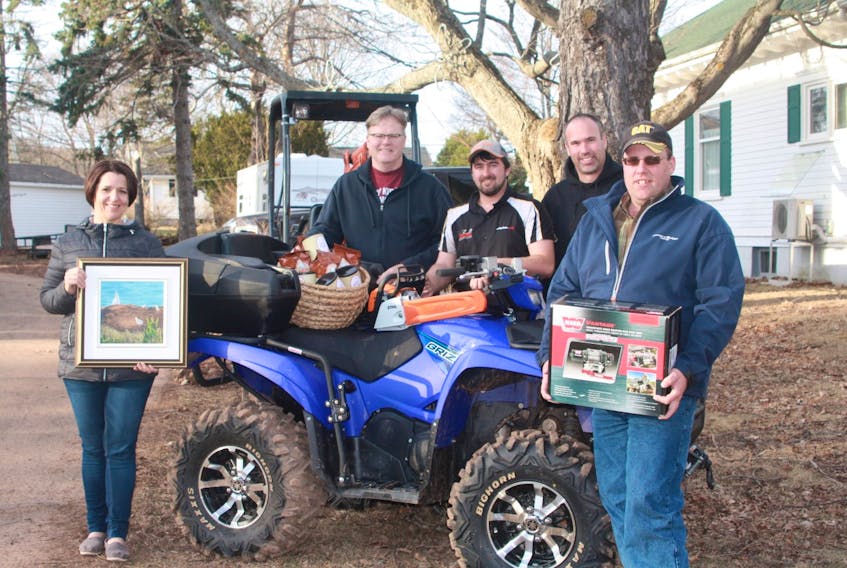 Susanne Arsenault, left, Sandy Rundle, Matt Arsenault, Trevor Hogan, and Scott Howatt, members of the Quad Trax ATV Club are gearing up for a new fundraiser – “Bids to Build” – to raise funds to expand the ATV trail network in the central part of the province.