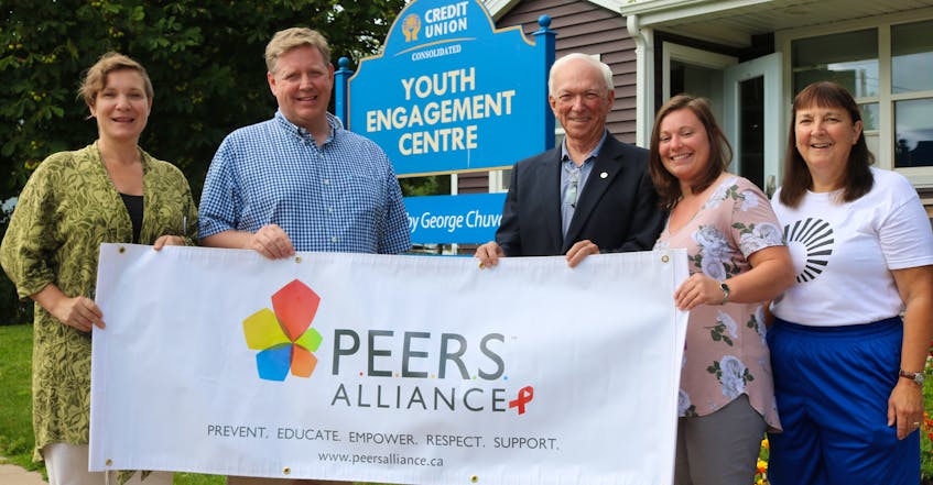 P.E.I. PEERS Alliance executive director Cybelle Rieber, from left, stands outside the Credit Union Youth Engagement Centre with P.E.I. Queer Youth Collective Summerside Chapter sponsor Jamie Niessen of the TELUS Atlantic Canada Community Board, John Robinson of the Community Foundation of P.E.I. which sponsors the Summerside chapter, P.E.I. PEERS Alliance program director Angele DesRoches and community volunteer Janet Bradshaw.