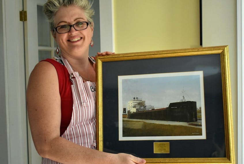 Ceilidh Barnett was presented with this picture, “In recognition of her exemplary service on the Canadian Olympic,” on Nov. 22, 2009. The ship is one of the many she sailed on during her seven-year career as a cook.