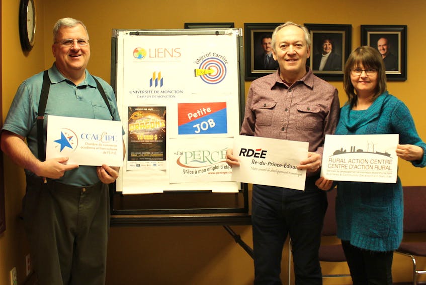 Preparing for the "RDÉE Road Show" promotional tour are, from left, Raymond J. Arsenault, coordinator of the Acadian and Francophone Chamber of Commerce of PEI, Robert Maddix, RDÉE PEI's economic development officer in charge of immigration, and Velma Robichaud, coordinator of the 2018 Dragons' Contest and client information officer with the Wellington Rural Action Centre.