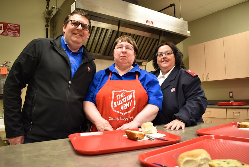 Salvation Army Captain Neil Abbot, left, with cook Brenda Arsenault and Captain Dolores Abbot at the soup kitchen in Summerside. The Abbots are leaving Summerside to take up a new posting at the end of June.